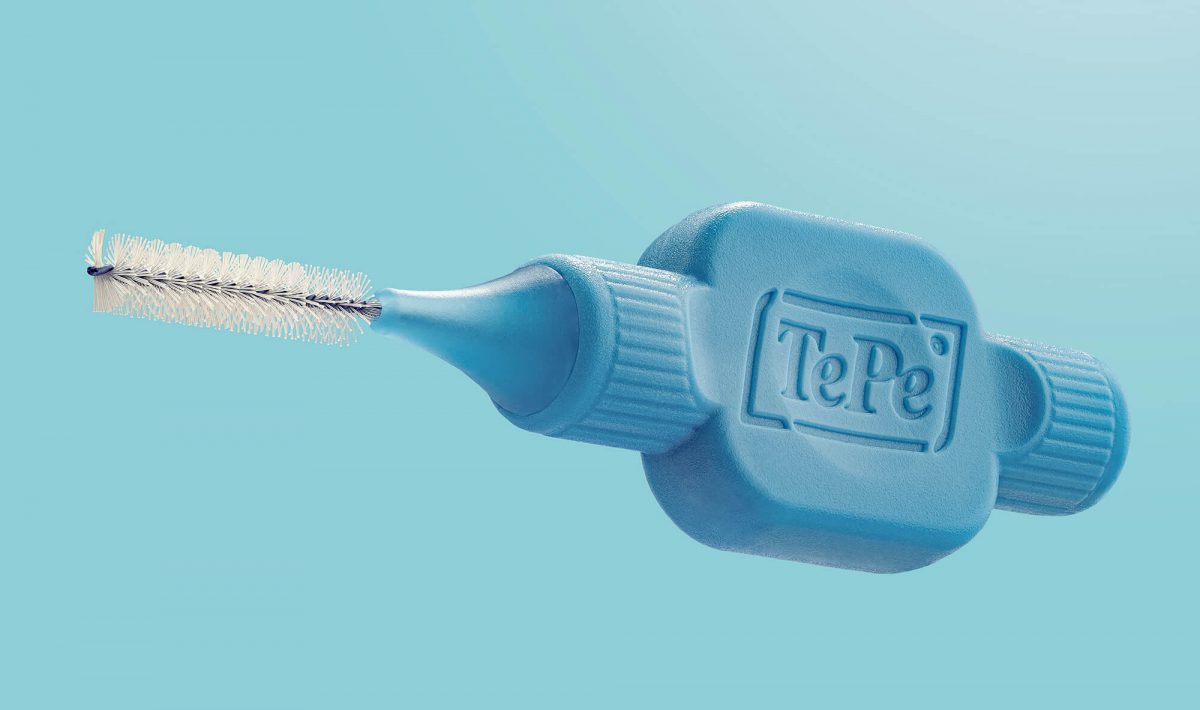 TePe close-up tooth brush. Blue product and colorful. 